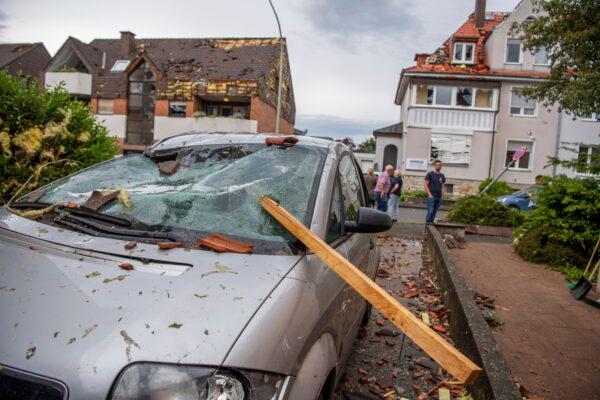 A damaged car is seen after a storm in Paderborn, Germany, on May 20, 2022. (Lino Mirgeler/dpa via AP)