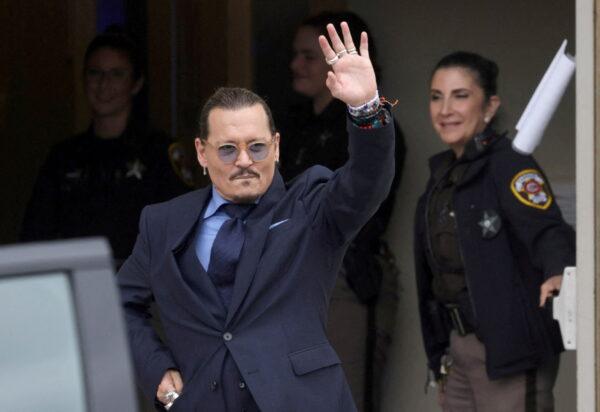 Actor Johnny Depp gestures as he leaves the Fairfax County Circuit Courthouse following his defamation trial against his ex-wife Amber Heard, in Fairfax, Va., on May 27, 2022. (Evelyn Hockstein/Reuters)