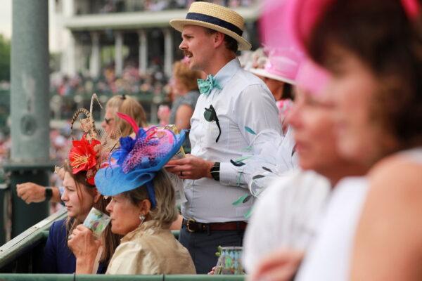 Spectator cheer during the 3rd race on the day of the 148th Thurby, the Thursday before Kentucky Derby at Churchill Downs in Louisville, Ky., on May 5, 2022. (Amira Karaoud/Reuters)