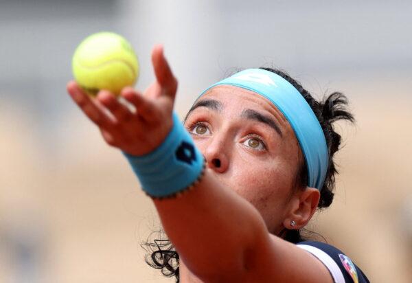 Tunisia's Ons Jabeur in action during her first round match against Poland's Magda Linette at the French Open on May 22, 2022. (Yves Herman/Reuters)
