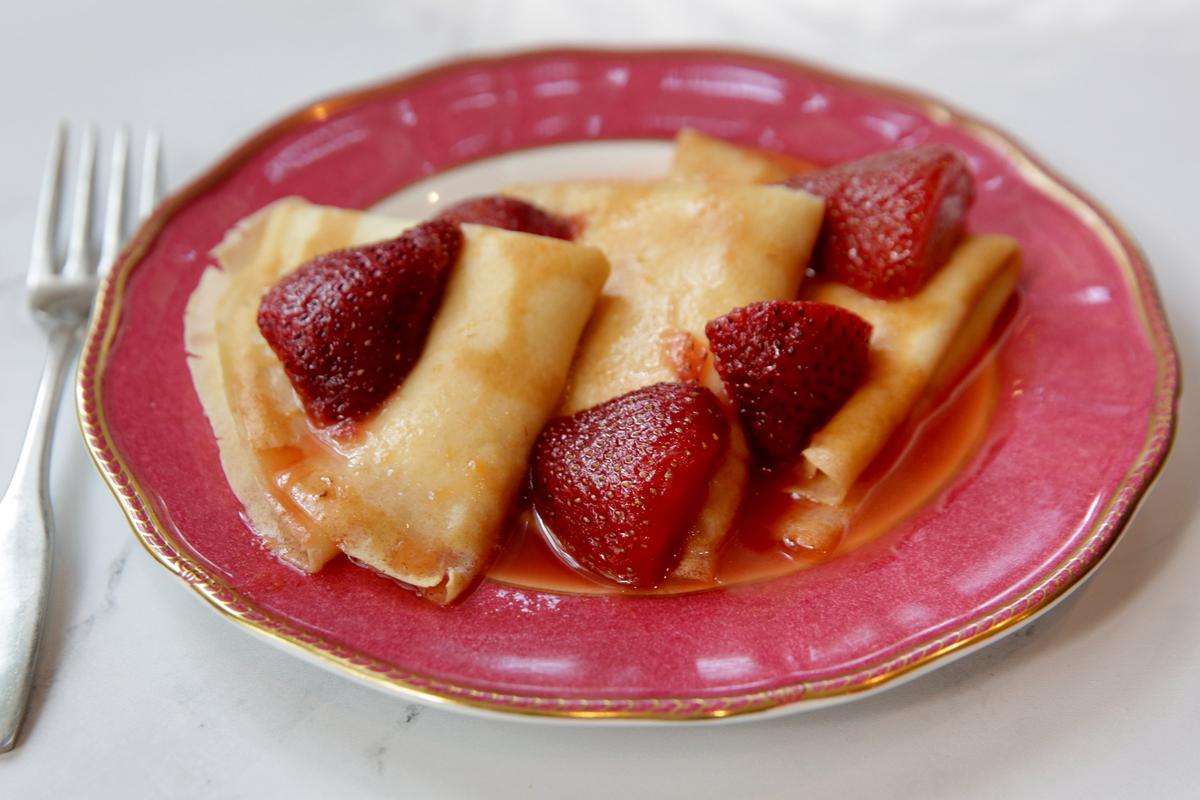 Strawberry flambée over lemon ricotta-filled crepes, Wednesday, May 11, 2022. (Hillary Levin/St. Louis Post-Dispatch/TNS)