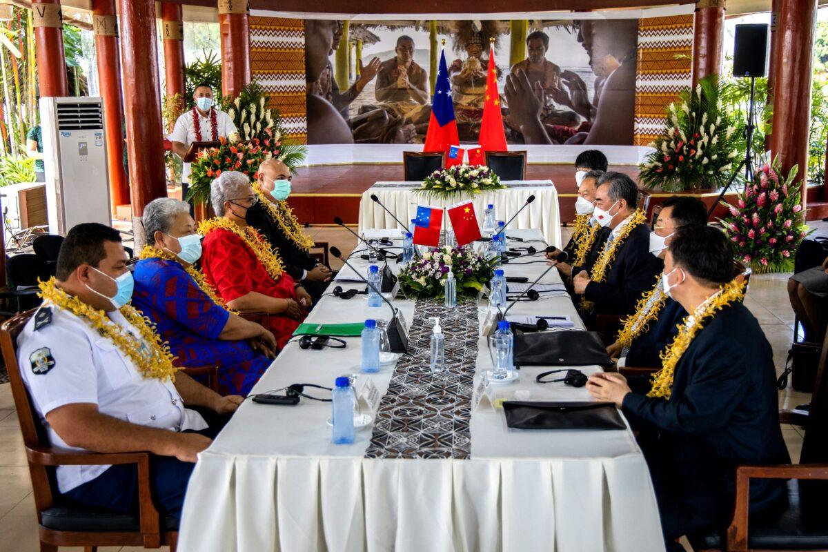 Chinese Foreign Minister Wang Yi (3rd R) holding a meeting with Samoan Prime Minister Fiame Naomi Mataafa (3rd L) after an agreements signing ceremony between the two countries in Apia, Samoa, on May 28, 2022. (Vaitogi Asuisui/Samoa Observer/AFP via Getty Images)