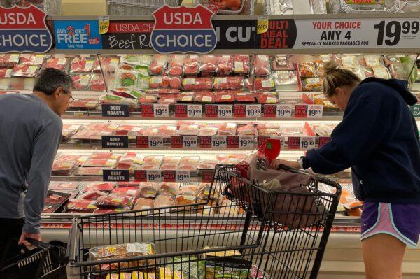 Consumers shop for meat at a grocery store in Annapolis, Md., on May 16, 2022. (Jim Watson/AFP/Getty Images)