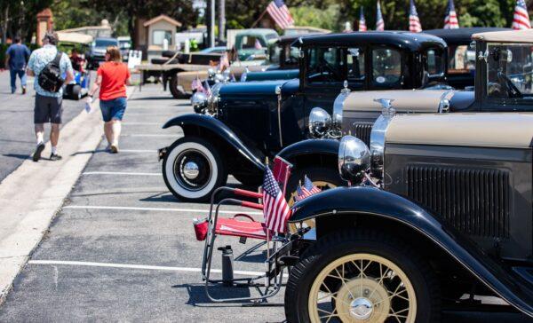 Classic cars line the edge of Fairhaven Memorial Park at the annual Memorial Day Service in Santa Ana, Calif., on May 30, 2022. (John Fredricks/The Epoch Times)