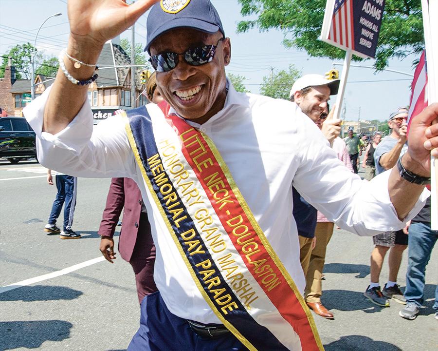 New York City Mayor Eric Adams (D) smiles for the Epoch Times as he marches in the 2022 Memorial Day parade in Little Neck-Douglaston, N.Y., on May 30, 2022. (Dave Paone:The Epoch Times)