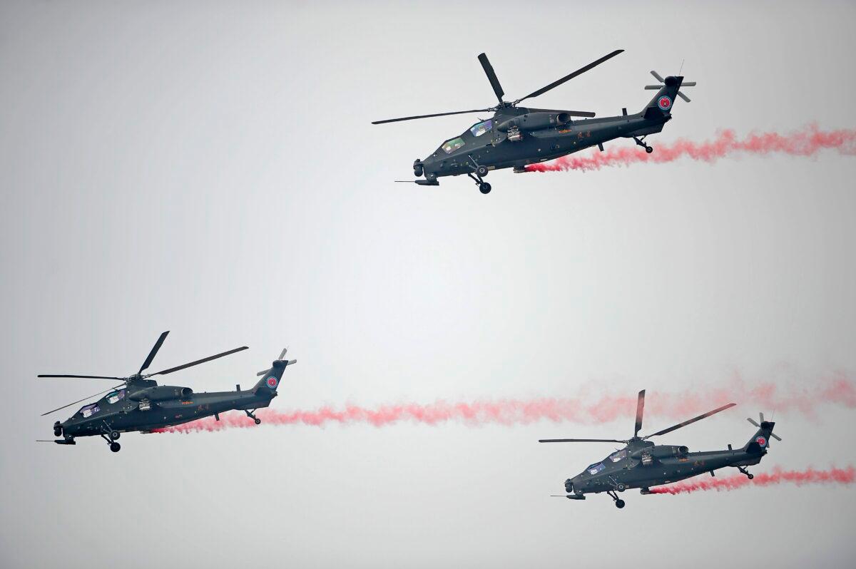 A group of China-made Z-10 helicopters perform in the air during the annual Tianjin International Helicopter Expo in Tianjin, China, on Sept. 9, 2015. (Feature China/Future Publishing via Getty Images)