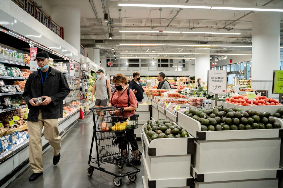 People shop at a grocery store in New York City on May 31, 2022. U.S. inflation reached a 40-year high of 8.5 percent in March, and prices are expected to continue to rise for staples like bread, meat, and milk as farmers face shortages of fuel, fertilizer, and other materials. (Samira Bouaou/The Epoch Times)