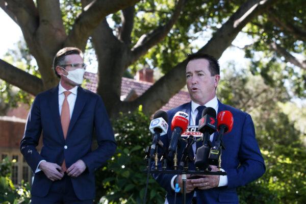 Police minister Paul Toole (R) speaks during a press conference at Government House in Sydney, Australia on October 06, 2021. (Photo by Lisa Maree Williams/Getty Images)