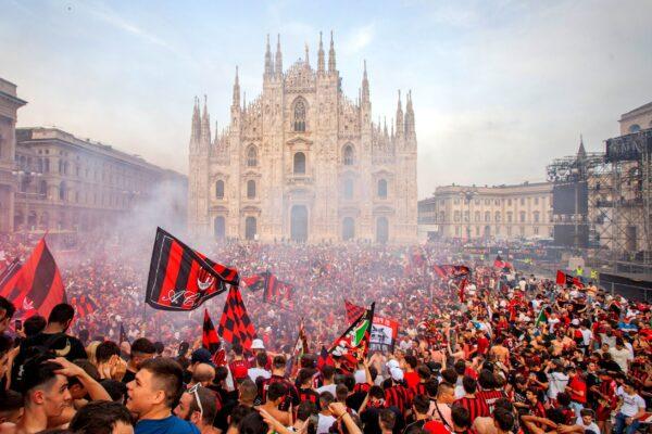 AC Milan fans celebrate in Piazza Duomo square after a Serie A soccer match between Sassuolo and AC Milan, being played in Reggio Emilia, in Milan, Italy, on May 22, 2022. (LaPresse via AP)