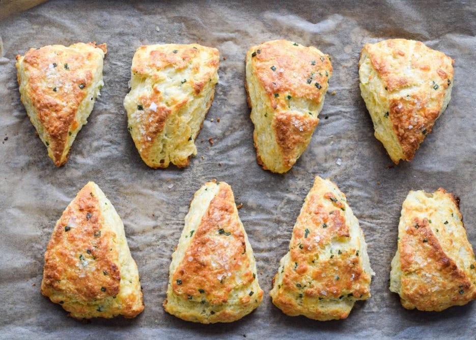 These savory scones with buttermilk, extra-sharp cheddar and finely chopped chives are delightful. And if you can’t decide between sweet or savory for brunch, may we suggest a smear of butter and fig preserves on these toasty scones? (Photo courtesy of West of the Loop) <a href="https://www.thedailymeal.com/best-recipes/breakfast-brunch-savory-cheddar-herb-scones">For the Savory Cheddar Herb Scones recipe, click here</a>.