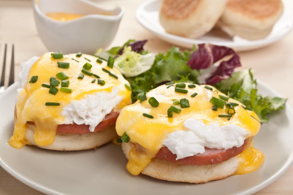 Nothing says brunch like a classic eggs Benedict — <a href="https://www.thedailymeal.com/cook/how-to-poach-egg">perfectly poached eggs</a> over a buttered toasted English muffin and a slice of Canadian bacon, topped with Hollandaise sauce and chives. It’s a luxurious dish that requires some careful technique, but it’s a lot easier than it looks. (Olga Nayashkova/Shutterstock) <a href="https://www.thedailymeal.com/recipes/easy-classic-eggs-benedict-recipe">For the Classic Eggs Benedict recipe, click here.</a>