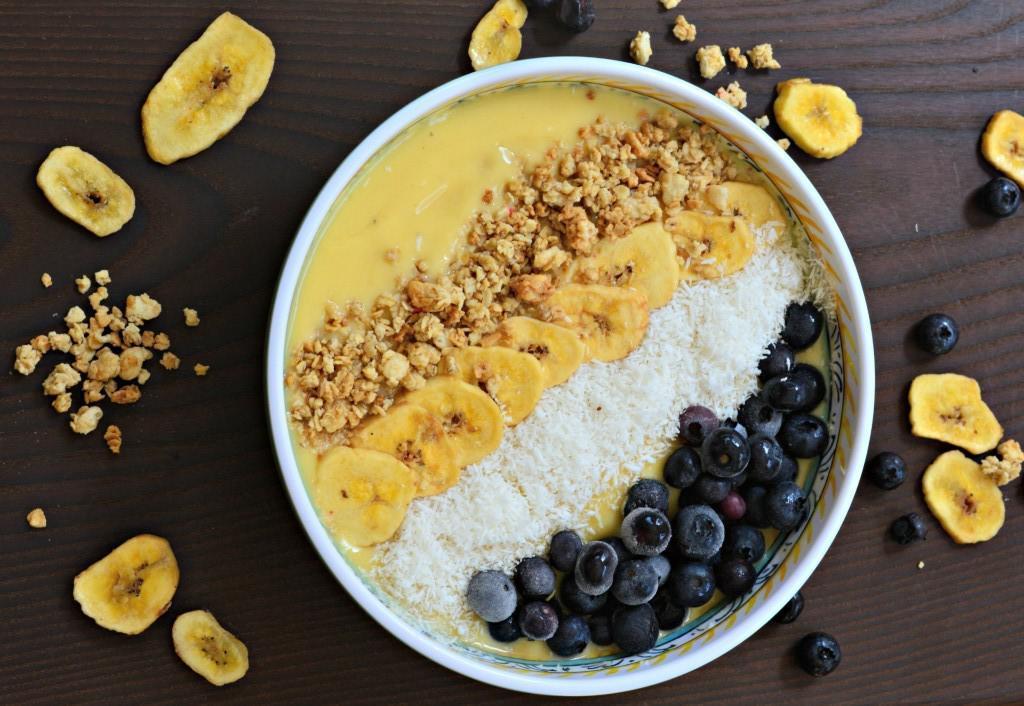 Smoothie bowls are thicker than a regular smoothie and topped with things like granola, fruit and berries — and in this case, coconut and banana chips as well. The base of the smoothie bowl includes frozen bananas, frozen or fresh mango and pineapple chunks and dairy-free yogurt. (Recipe courtesy of West of the Loop) <a href="https://www.thedailymeal.com/best-recipes/tropical-smoothie-bowl-dairy-free-yogurt">For the Tropical Smoothie Bowl with Dairy-Free Yogurt recipe, click here</a>.