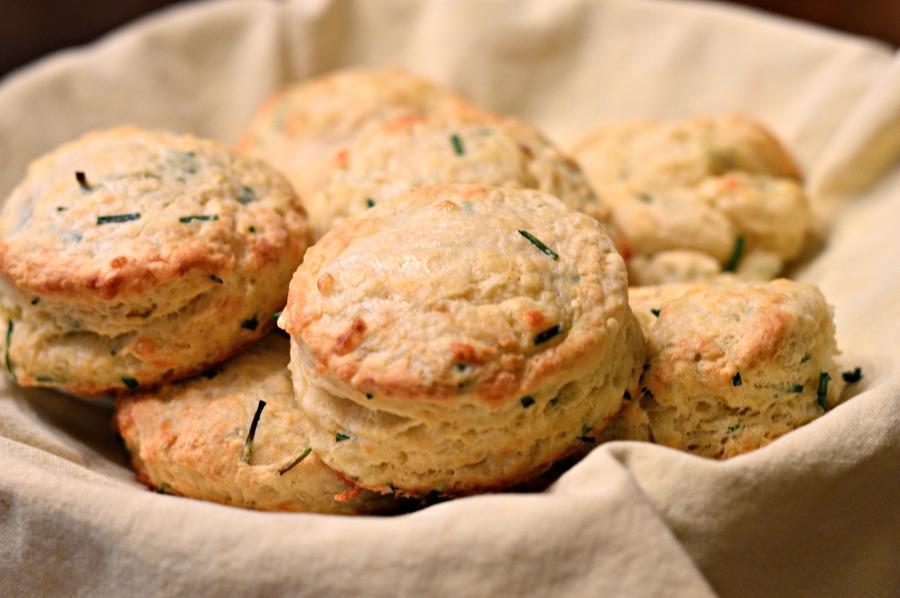 Similar to savory scones, these chive and cheddar buttermilk biscuits are a welcome addition to any brunch spread. Even though making any bread-like item might seem daunting, you can actually have <a href="https://www.thedailymeal.com/cook/americas-25-favorite-home-cooked-dishes">comforting and homemade</a> flaky biscuits on the table in less than half an hour. (Photo courtesy of West of the Loop) <a href="https://www.thedailymeal.com/best-recipes/brunch-chive-cheddar-buttermilk-biscuits">For the Chive and Cheddar Buttermilk Biscuits recipe, click here</a>.