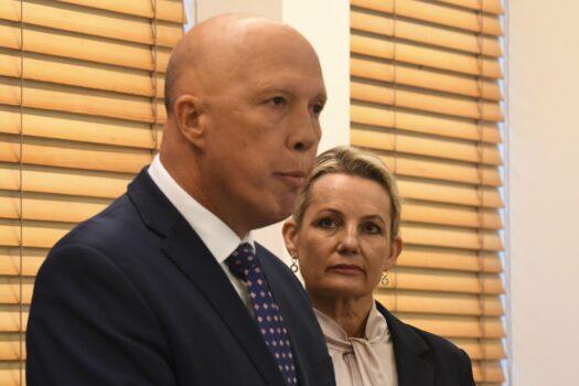 Deputy Leader of the Liberal Party Sussan Ley (right) listens to the newly elected Leader of the Liberal Party Peter Dutton speak to the media after a party room meeting at Parliament House in Canberra, Australia, on May 30, 2022. (AAP Image/Lukas Coch)