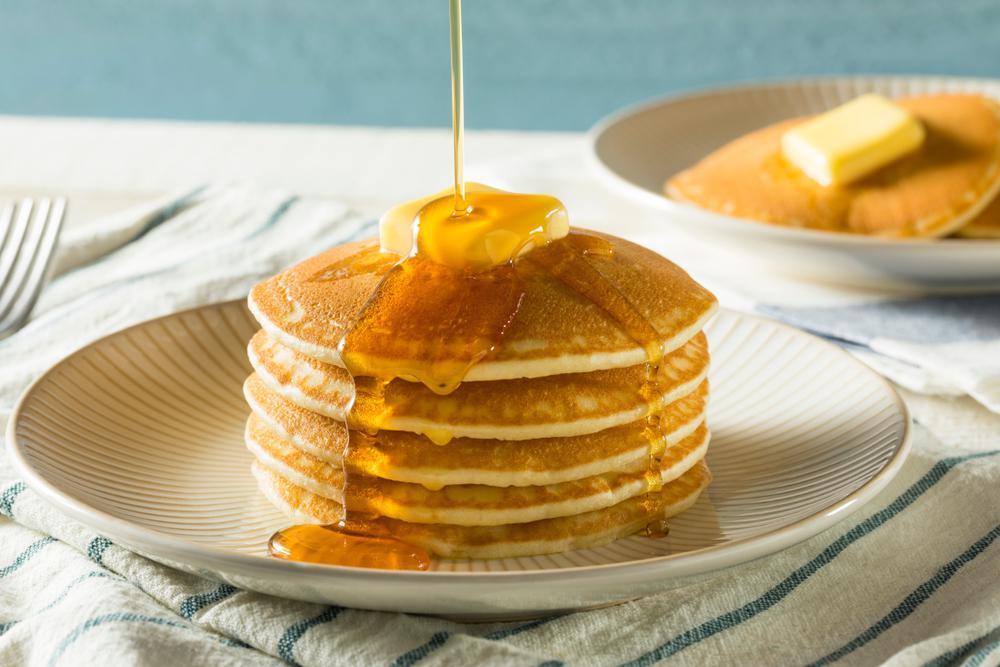 A stack of fluffy pancakes with syrup drizzling down the sides is the perfect centerpiece for any breakfast or brunch. This classic recipe needs only a handful of common ingredients like milk, flour and eggs. And as for the rest, you’d be surprised at how many <a href="https://www.thedailymeal.com/eat/improve-pancakes-ingredients">unexpected add-ins, mix-ins and toppings can make your pancakes even better.</a>  (Brent Hofacker/Shutterstock) <a href="https://www.thedailymeal.com/recipes/easy-classic-pancakes-recipe">For the Classic Pancakes recipe, click here.</a>