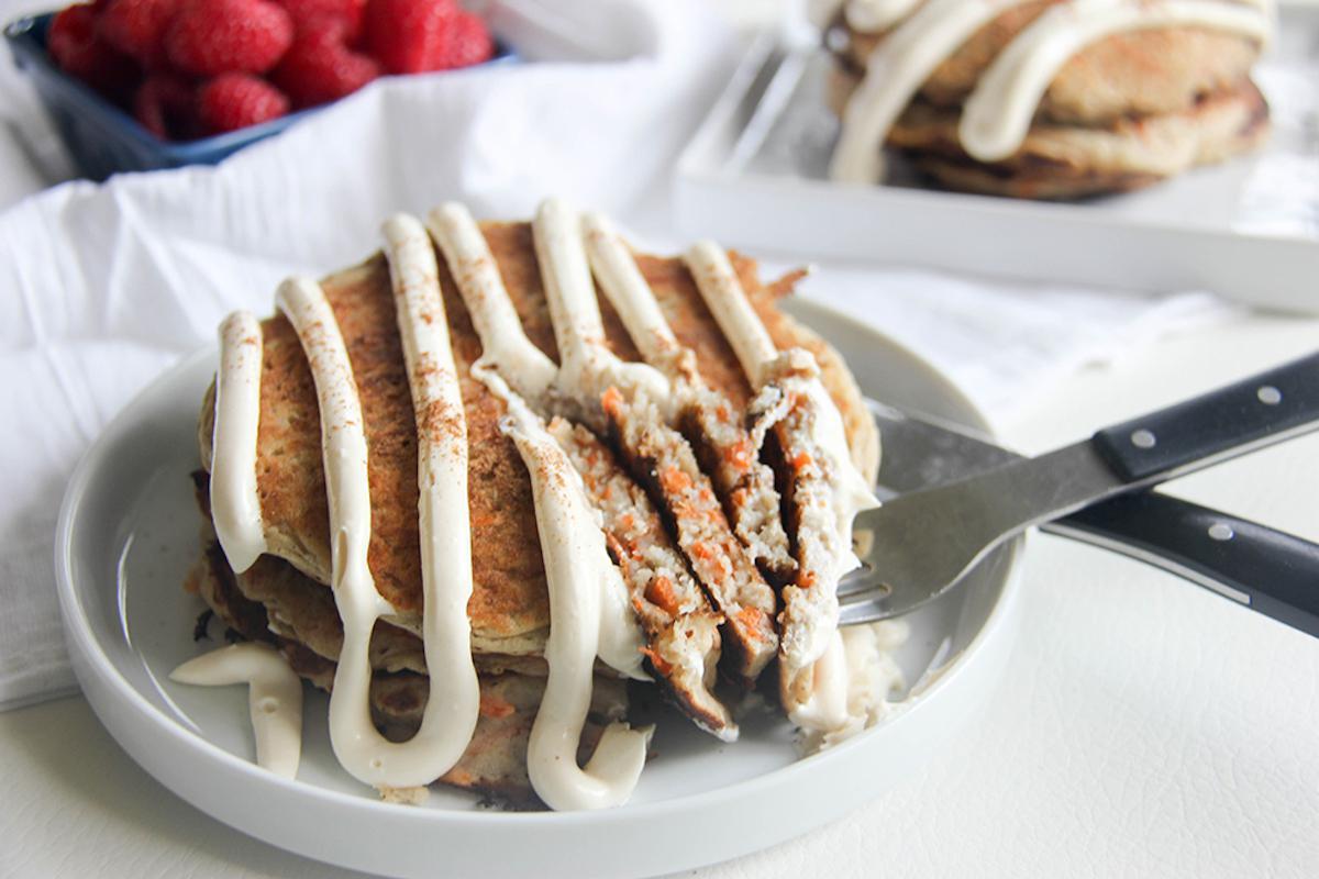 A two-in-one dessert and brunch, these carrot cake pancakes are fluffy, rich and smothered with cream cheese topping. To make the pancake part easier, grab a boxed mix (regular or gluten-free) and add shredded carrots, almond milk, brown sugar, vanilla, cinnamon and nutmeg along with a few other pantry ingredients. (Photo courtesy of Simply Healthyish Recipes) <a href="https://www.thedailymeal.com/best-recipes/carrot-cake-pancakes-cream-cheese">For the Carrot Cake Pancakes recipe, click here. </a>