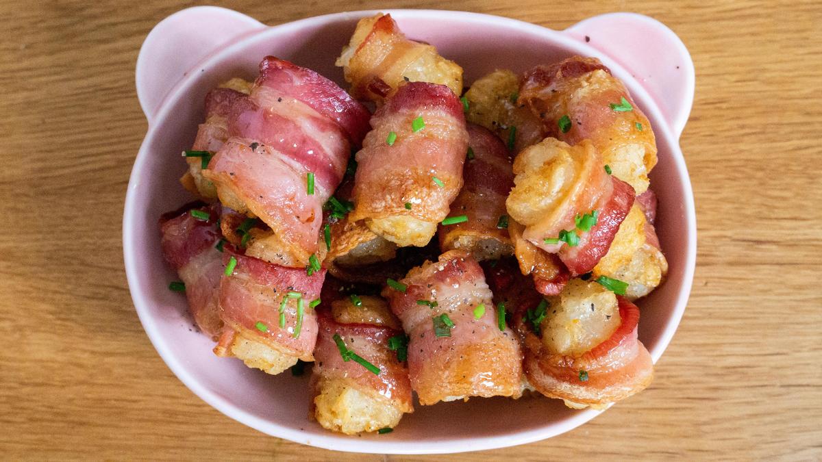 If you’re looking for a <a href="https://www.thedailymeal.com/entertain/25-best-party-foods-recipes-slideshow">quick and easy appetizer</a> to add to your brunch table, these honey bacon-wrapped Tater Tots are ideal. They require no more than three ingredients and 20 minutes to throw together. (Jacqui Wedewer/The Daily Meal) <a href="https://www.thedailymeal.com/recipes/honey-bacon-wrapped-tater-tots-recipe">For the Honey Bacon-Wrapped Tater Tots recipe, click here.</a>
