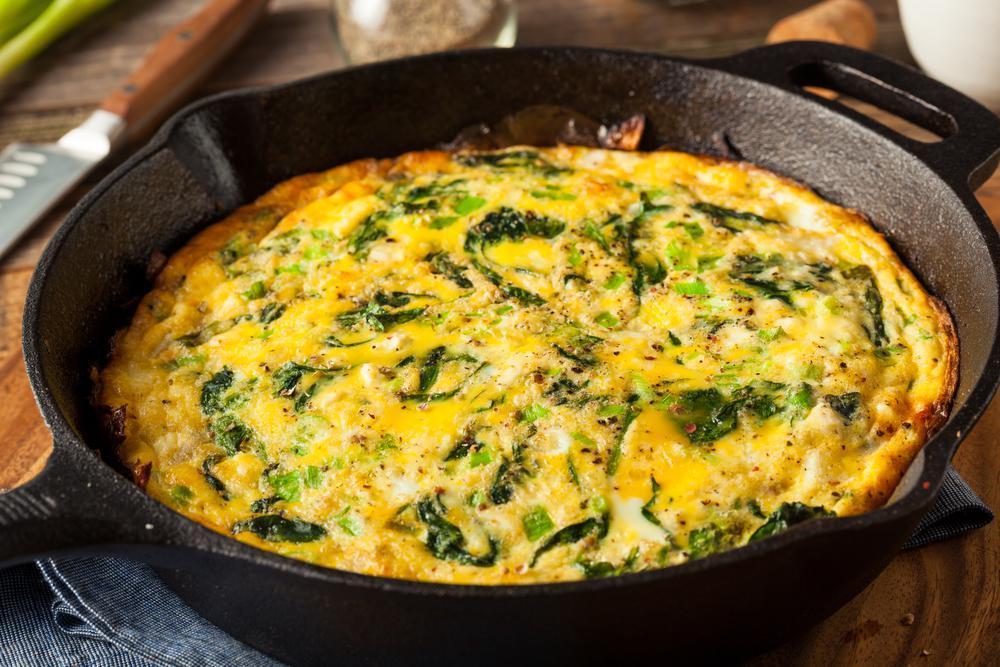 Frittatas are incredibly easy to make without even using a recipe. Once you’ve nailed down the base of eggs, milk (or heavy cream) and salt and pepper, you can add just about anything you’d like before popping it in the oven. If you’re trying to get more veggies into your diet, frittatas are a great way to sneak some greens in. (Brent Hofacker/Shutterstock) <a href="https://www.thedailymeal.com/recipes/vegetable-and-cheese-frittata-recipe">For the Vegetable and Cheese Frittata recipe, click here.</a>