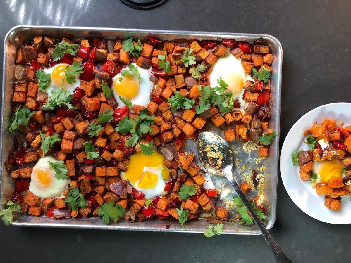 One-pan dishes are always a hit. They can easily feed a crowd without too much fuss. Vibrant sweet potatoes and eggs along with bright red peppers and fresh cilantro give this dish color and tons of flavor. (Photo courtesy of David Kaplan) <a href="https://www.thedailymeal.com/one-pan-sweet-potato-hash">For the One-Pan Sweet Potato and Egg Hash recipe, click here.</a>