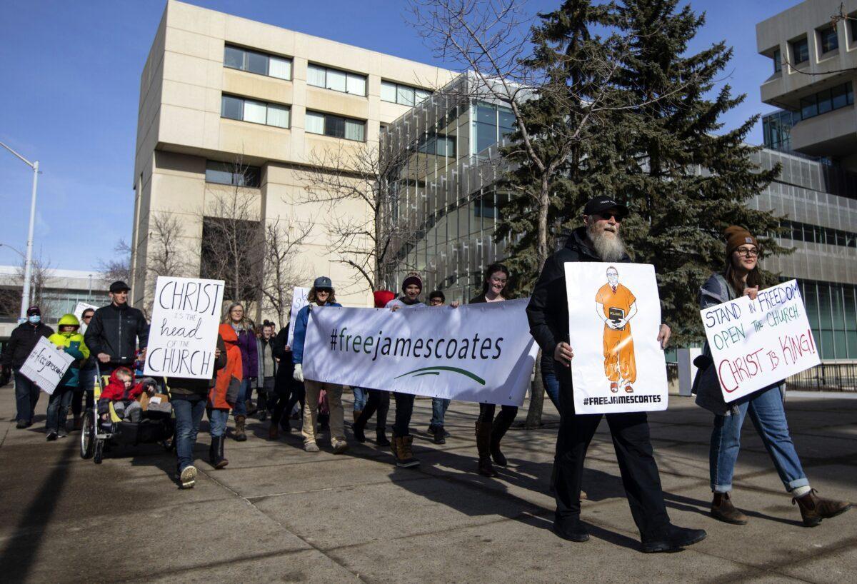 Supporters rally outside court as Pastor James Coates of GraceLife Church appeals his bail conditions after he was arrested for holding church services in violation of COVID-19 rules, in Edmonton on March 4, 2021. (The Canadian Press/Jason Franson)