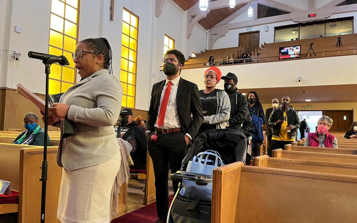 People line up to speak during a reparations task force meeting at Third Baptist Church in San Francisco on April 13, 2022. (Janie Har/AP Photo)