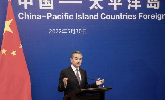 Chinese Foreign Minister Wang Yi speaks during a joint press conference with Fijian Prime Minister Frank Bainimarama in Fiji's capital city Suva on May 30, 2022. (Leon Lord/AFP via Getty Images)