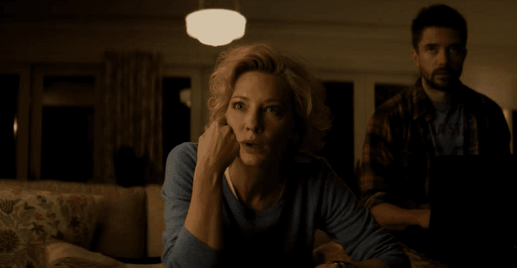 Mary Mapes (Cate Blanchett) and Mike Smith (Topher Grace), horrified, watch the news, in "Truth." (Lisa Tomasetti/Sony Pictures Classics)