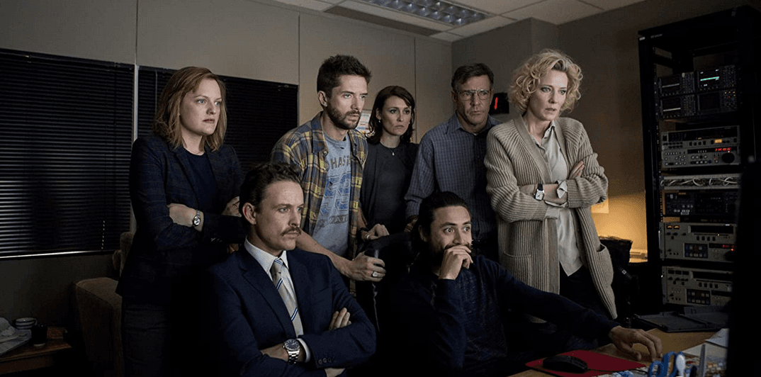 (L–R) Lucy Scott (Elisabeth Moss), Josh Howard (David Lyons), Mike Smith (Topher Grace), Mary Murphy (Natalie Saleeba), Tom (Adam Saunders), Lt. Col. Roger Charles (Dennis Quaid), and Mary Mapes (Cate Blanchett), in "Truth." (Lisa Tomasetti/Sony Pictures Classics)