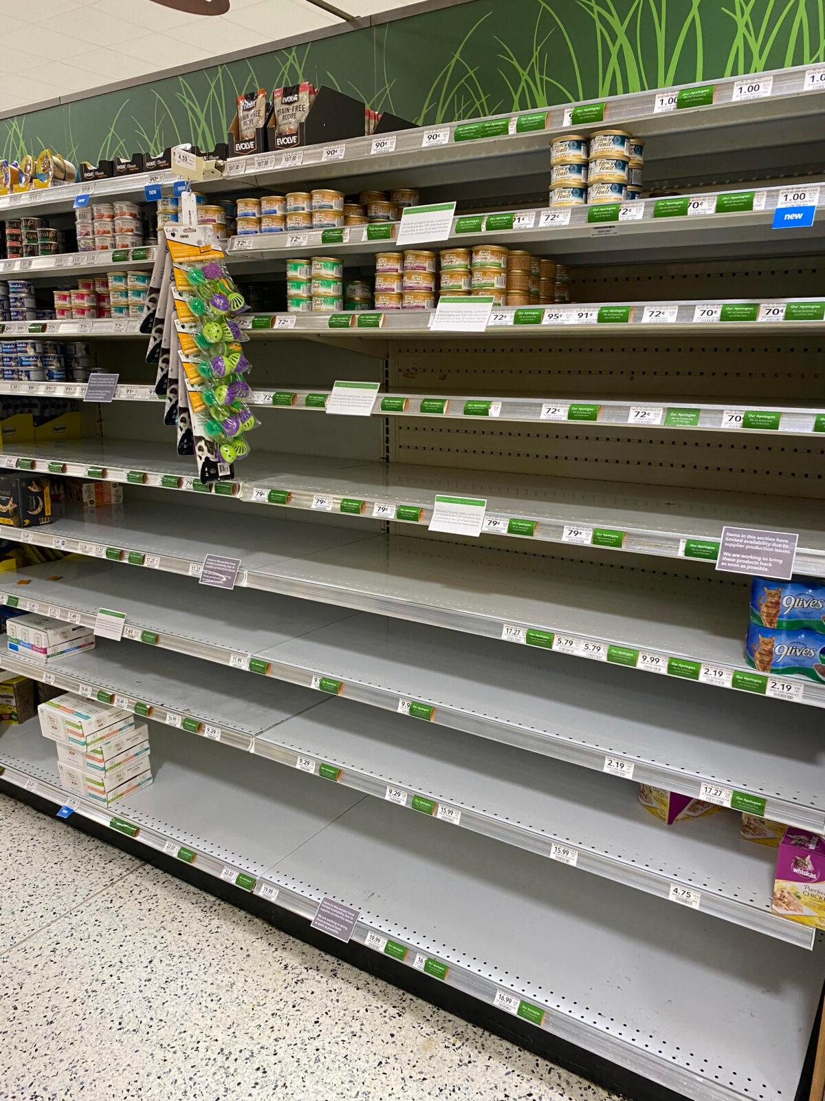 The cat food shelves at a Publix store in Hernando County, Fla., appear empty during the peak of what shelter staff refer to as "cat season" on May 28, 2022. (Patricia Tolson/The Epoch Times)