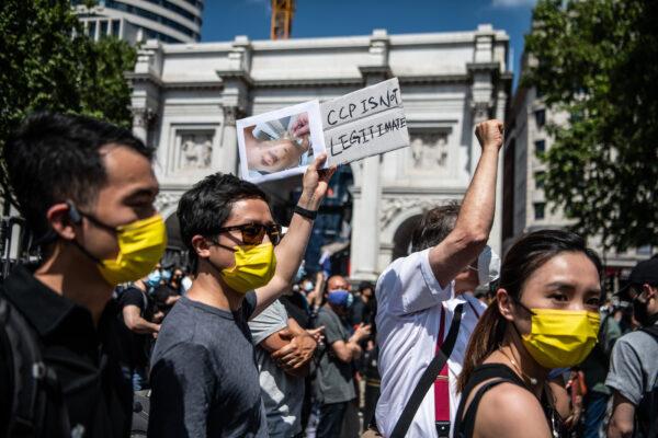Protesters attend a rally for Hong Kong democracy at the Marble Arch on June 12, 2021 in London, England. (Laurel Chor/Getty Images)