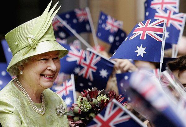 Queen Elizabeth ll smiles amongst Australian flags being waved by the crowd after the Commonwealth Day Service in Sydney, Australia, on March 13, 2006. (Rob Griffith/Pool/Getty Images)