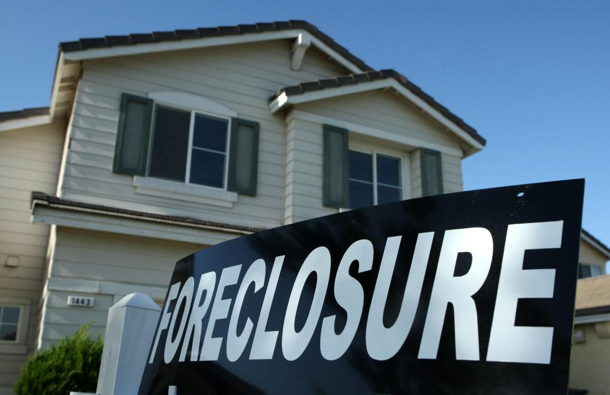 A foreclosure sign is posted in front of a home for sale in Stockton, Calif., on April 29, 2008. (Justin Sullivan/Getty Images)