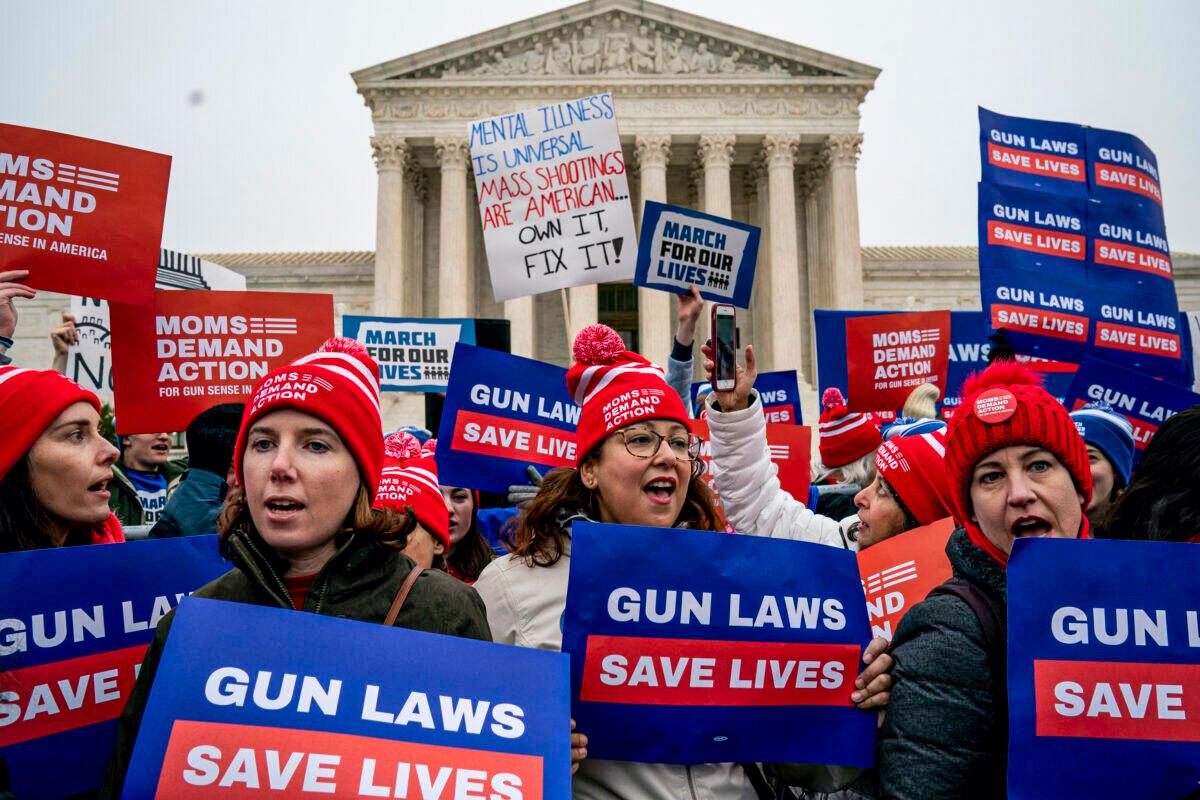  Gun safety advocates rally in front of the U.S. Supreme Court during oral arguments in the Second Amendment case NY State Rifle & Pistol v. City of New York, N.Y., in Washington, on Dec. 2, 2019. (Drew Angerer/Getty Images)