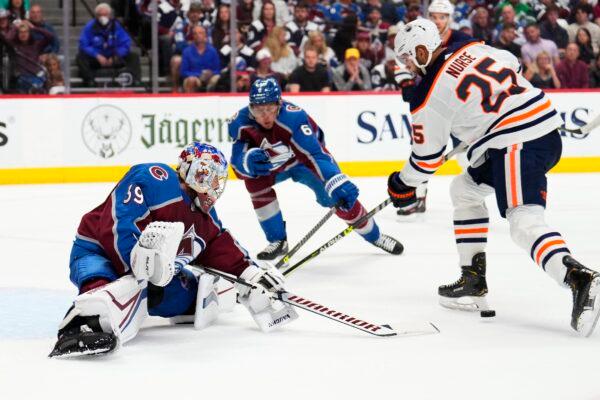  Colorado Avalanche goaltender Pavel Francouz (39) blocks a shot by Edmonton Oilers defenseman Darnell Nurse (25) during the second period in Game 2 of the NHL hockey Stanley Cup playoffs Western Conference finals in Denver, on June 2, 2022. (Jack Dempsey/AP Photo)