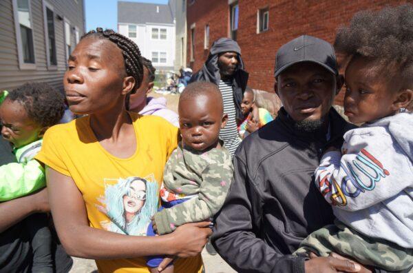Sylvie and Landry with their children, seeking asylum in Portland, Maine, on May 25, 2022. (Steven Kovac/The Epoch Times)