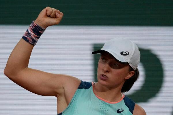 Poland's Iga Swiatek reacts after scoring a point as she plays Coco Gauff of the U.S. during the women final match of the French Open tennis tournament at the Roland Garros stadium in Paris, on June 4, 2022. (Christophe Ena/AP Photo)