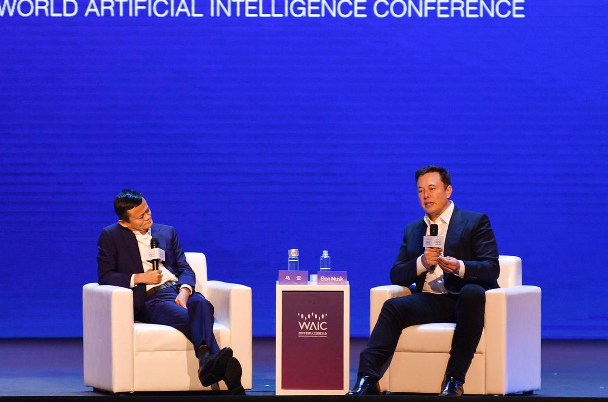 Elon Musk (R), Co-founder and CEO of Tesla, and Jack Ma, co-chair of the UN High-Level Panel on Digital Cooperation, speak onstage during the World Artificial Intelligence Conference (WAIC) in Shanghai on Aug. 29, 2019. (Hector Retamal/AFP via Getty Images)