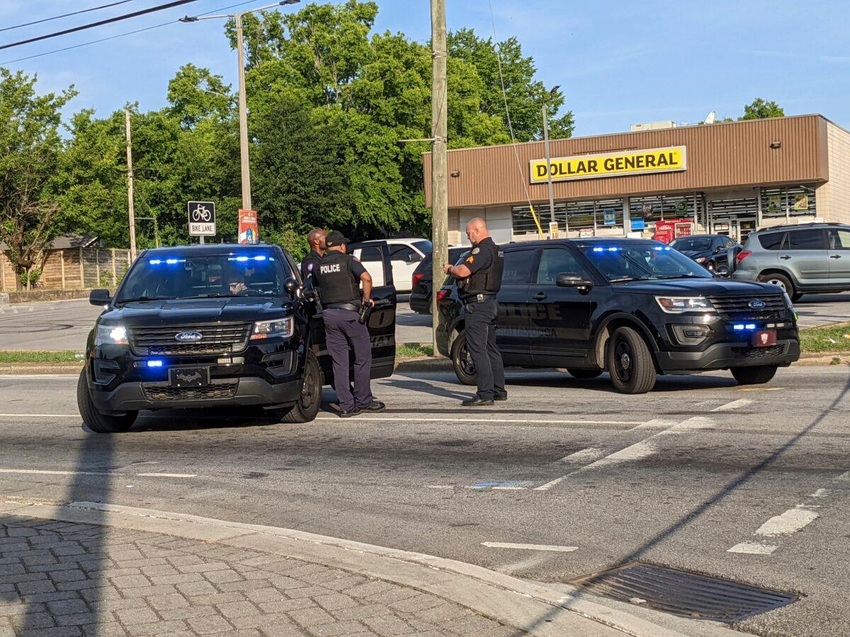 The Chattanooga Police Department stands near the scene following a shooting in Chattanooga, Tenn., on June 5, 2022. (Tierra Hayes/Chattanooga Times Free Press via AP)