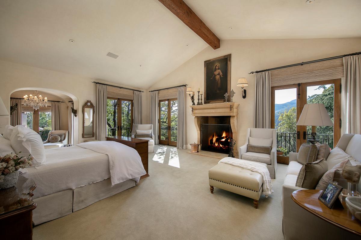 The master suite features 2 bathrooms, a warm fireplace, and more examples of brilliant structural and interior design. All the estate’s bedrooms are as richly appointed and tasteful. (Jim Bartsch/Jade Mills)