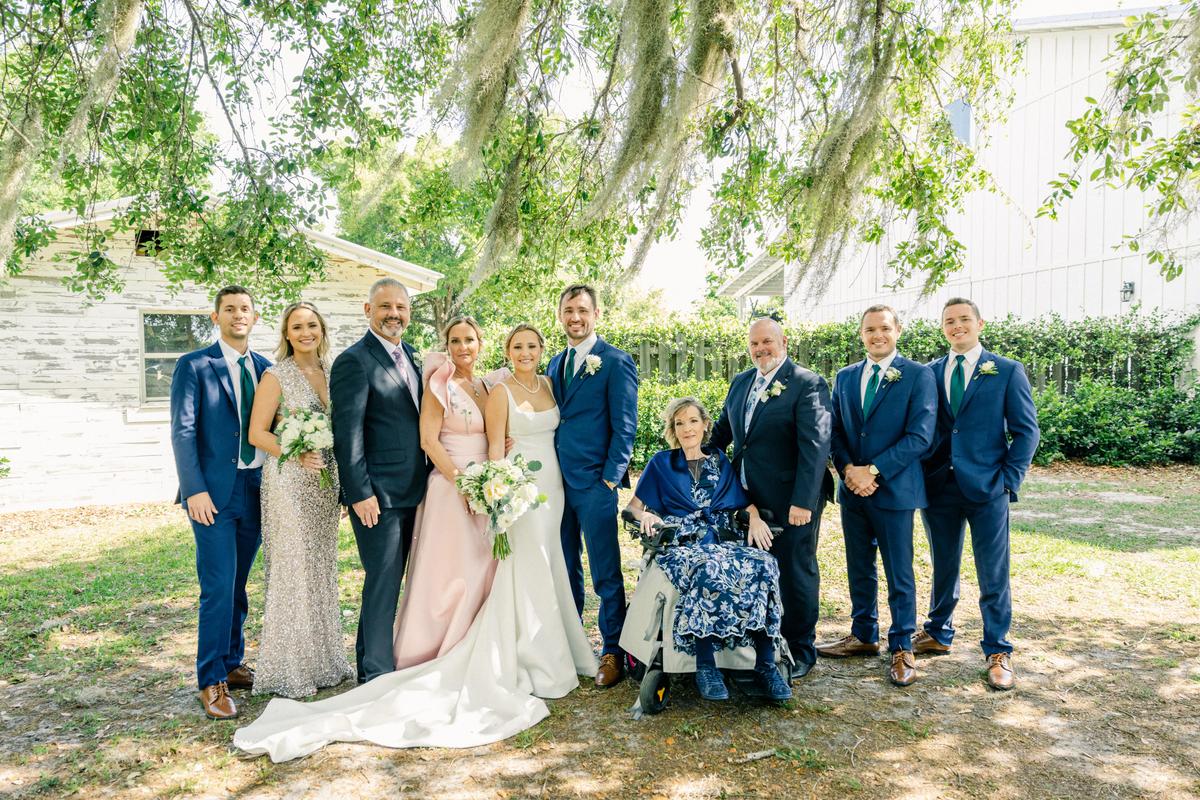 Zak and his wife with both their families on their wedding day. (Courtesy of Kathy Poirier)