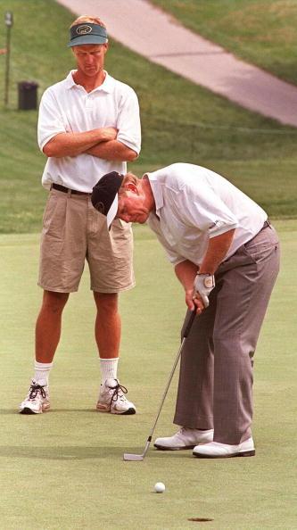 Jack Nicklaus putts as his son and caddie Jack Nicklaus II watches during the last day of practice for the 1997 U.S. Open Golf tournament June 11 at the Congressional Country Club in Bethesda, Md. (Luke Frazza/AFP via Getty Images)