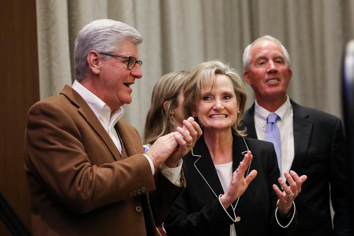 (L-R) Then-Gov. of Mississippi Phil Bryant applauds as U.S. Sen. Cindy Hyde-Smith (R-Miss.) prepares to take the stage for a victory speech during an election night event at The Westin Hotel, in Jackson, Miss., on Nov. 27, 2018. (Drew Angerer/Getty Images)