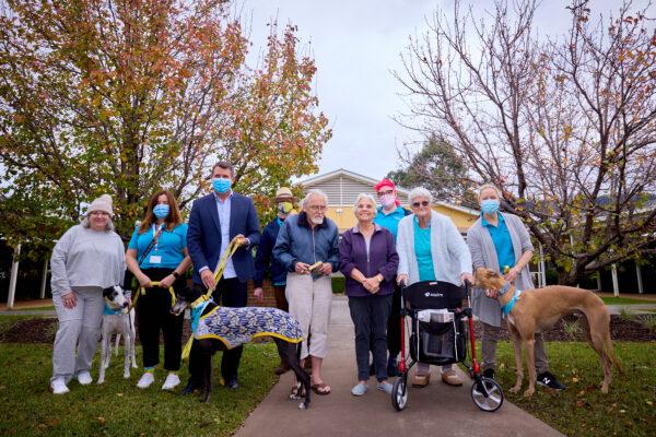 CEO Mike Baird with residents and the greyhound rescue team. (HammondCare/Supplied)