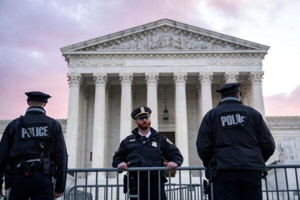 Supreme Court Police officers set up security barricades outside the U.S. Supreme Court on Nov. 1, 2021. (Drew Angerer/Getty Images)