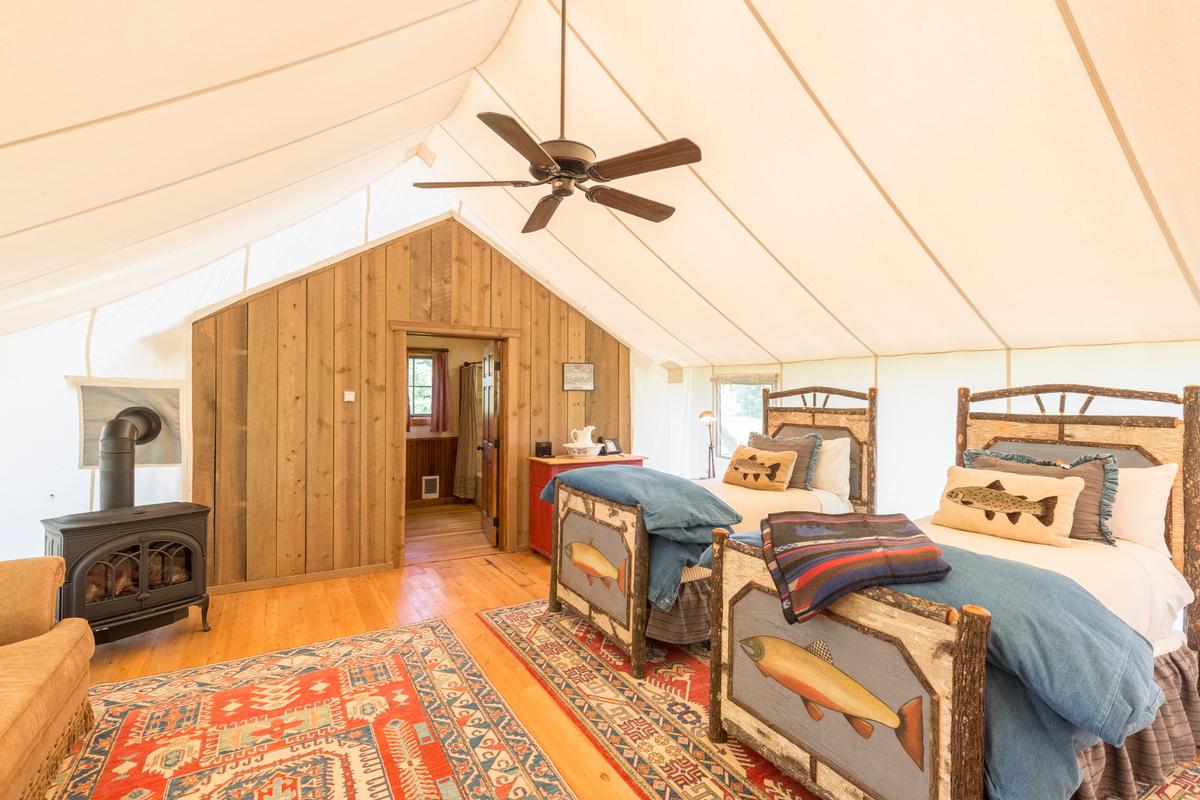 The ranch has glamping cabins that suit couples as well as families with kids. Pioneer wagons are also available, where guests will find a king-sized bed and twin bunks. (Courtesy of The Ranch at Rock Creek)