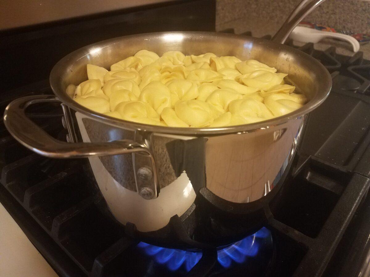 Cook the tortellini according to package instructions until al dente.