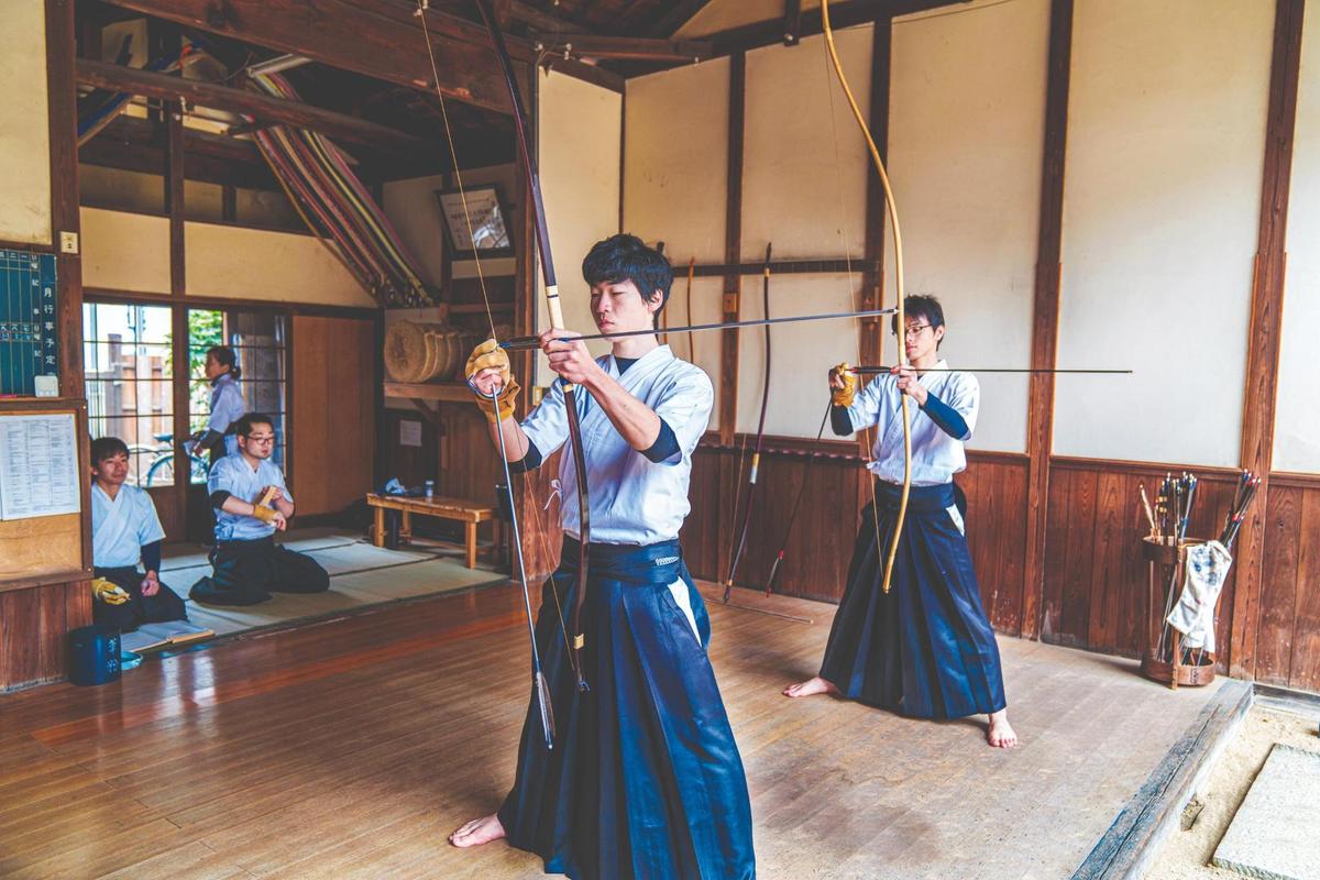 Traditional Japanese archers ready their bows. (JGalione/Getty)