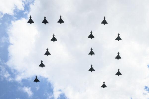 A formation of aircraft in the shape of the number 70 flies towards Buckingham Palace during a flypast to celebrate the first day of celebrations to mark the Platinum Jubilee of Queen Elizabeth II, in London, England, on June 2, 2022. (Leon Neal/Getty Images)