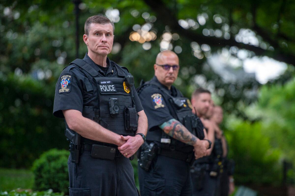 Police officers stand outside the home of U.S. Supreme Court Justice Brett Kavanaugh in Chevy Chase, Md., on May 18, 2022. (Bonnie Cash/Getty Images)
