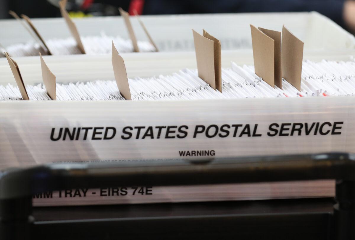 Boxes for Vote-by-Mail ballots that need to be reviewed due to signature discrepancies, as the Miami-Dade County Canvassing Board convenes ahead of the Nov. 3 general election at the Miami-Dade County Elections Department in Doral, Fla., on Oct. 15, 2020. (Joe Raedle/Getty Images)